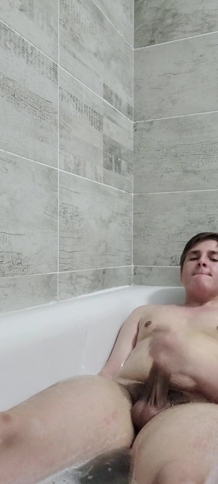 Chubby boy washes feet and masturbates in bathtub watch online